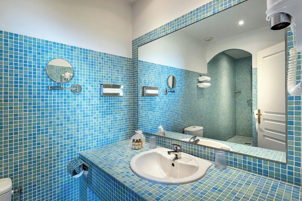 Combined shower/tub, free toiletries, hair dryer, slippers