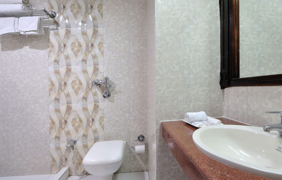 Shower, free toiletries, hair dryer, slippers