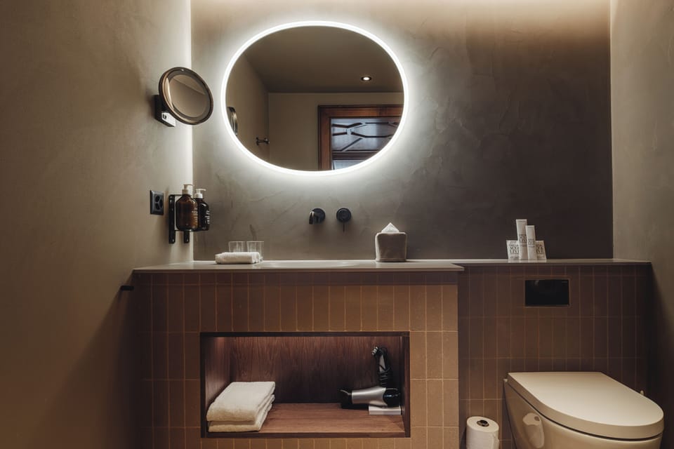 Comfort Room | Bathroom | Designer toiletries, hair dryer, bathrobes, slippers
