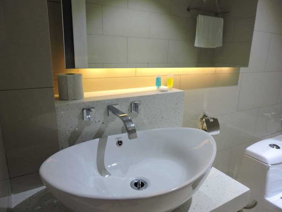 Separate tub and shower, free toiletries, hair dryer, slippers
