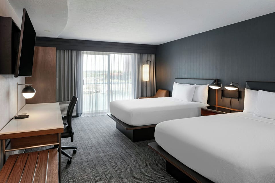 Premium bedding, desk, laptop workspace, iron/ironing board