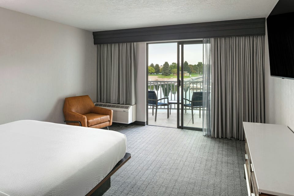 Premium bedding, desk, laptop workspace, iron/ironing board