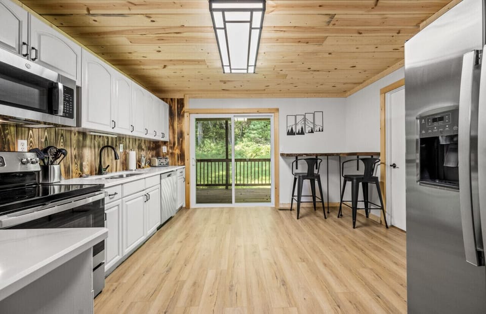 A fridge with icemaker, glass top stove & dishwasher are a few amenities.