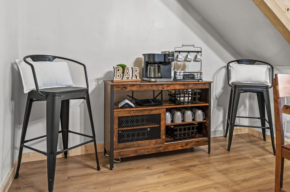The coffee station at the back of the dining room offers stool seating for 2.