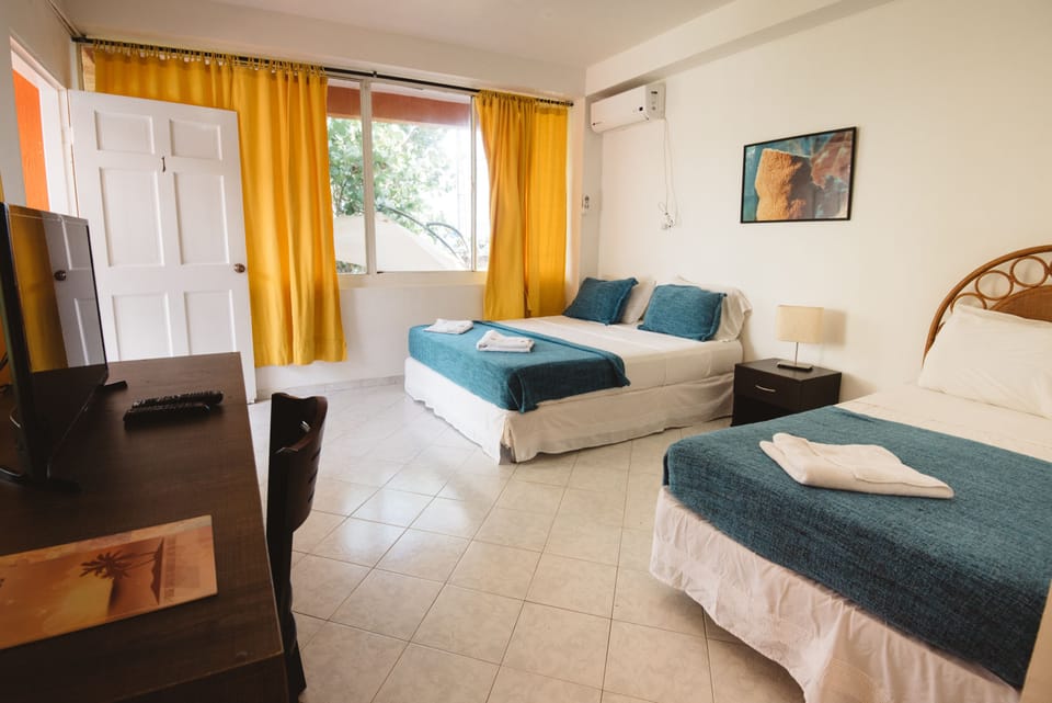 Twin Room, 2 Twin Beds, Partial Ocean View | In-room safe, desk, bed sheets