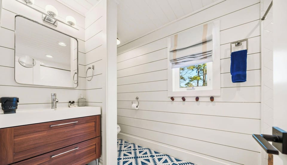 Step into this bathroom where bright lighting, clean finishes, and thoughtful details come together to create a fresh and functional space for your daily routine.