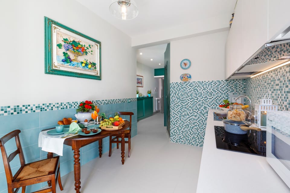 Apartment, 1 Bedroom, Balcony | Private kitchen | Microwave, coffee/tea maker, electric kettle, cookware/dishes/utensils