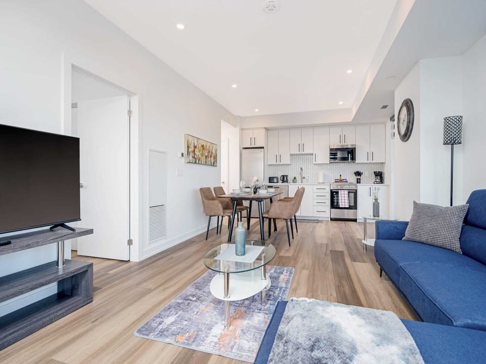 Open Living And Dining Area With Modern Décor And Smart TV