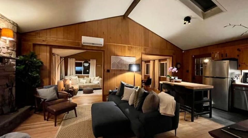 View from the bedroom out onto the open-concept living room and kitchen.