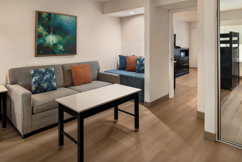 Suite, 1 Bedroom | Living area | 27-inch TV with cable channels