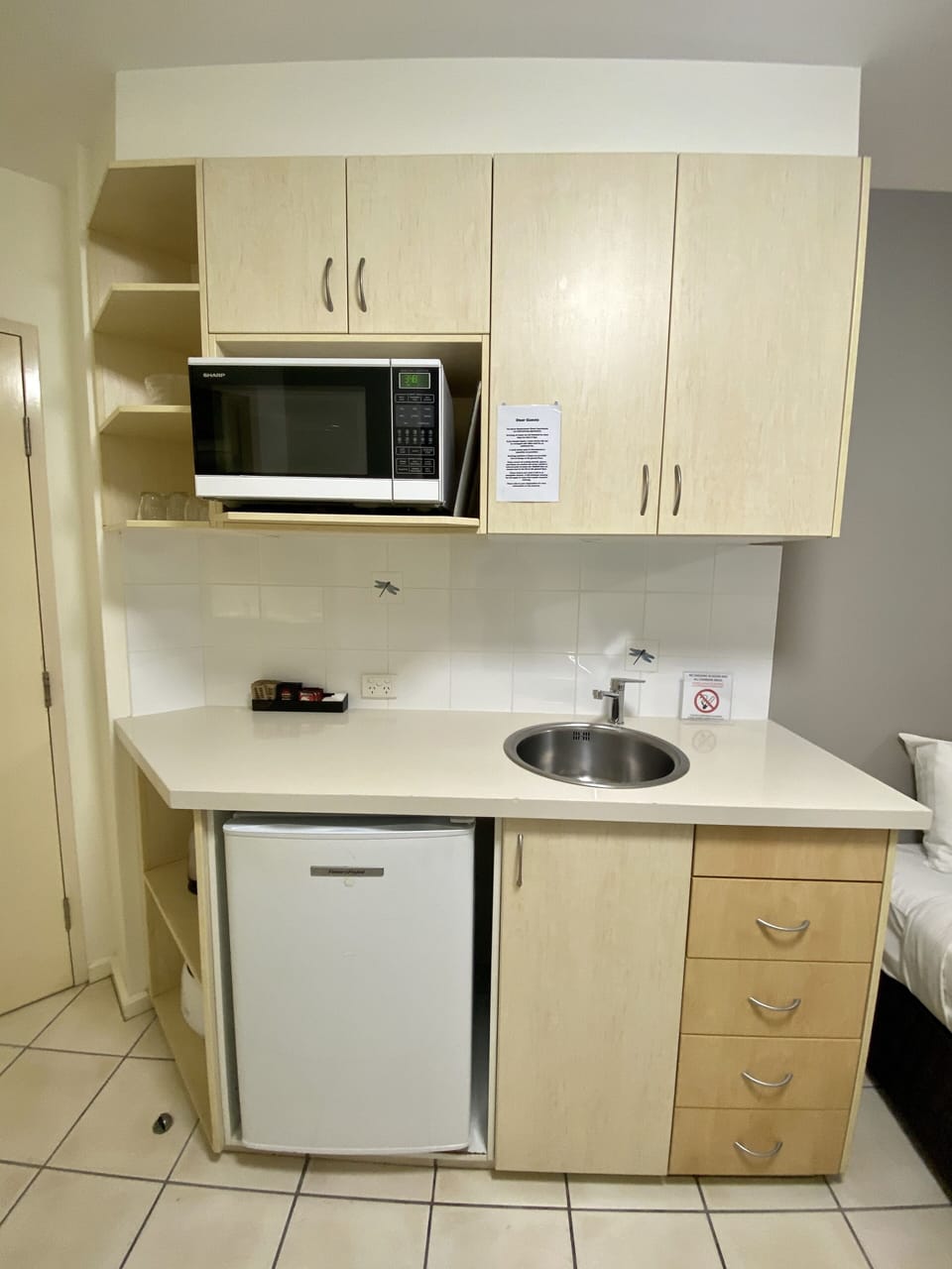 Fridge, microwave, electric kettle, cookware/dishes/utensils