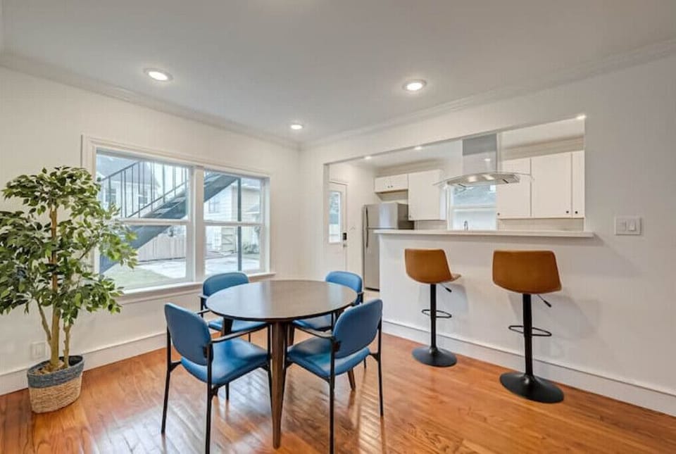 Dining area and kitchen on the right. 