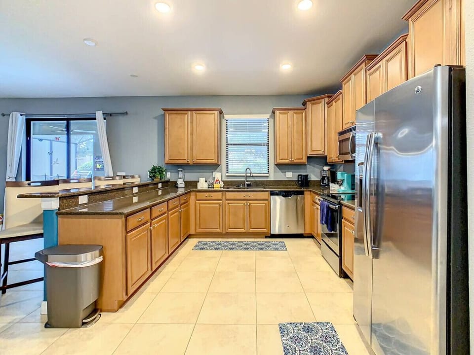 Whip up your favorite meals in a fully equipped open kitchen designed for both function and style.