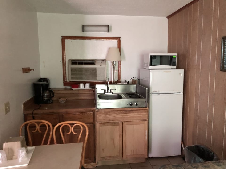 Triple Room, Multiple Beds | Private kitchenette | Coffee/tea maker, fridge, microwave