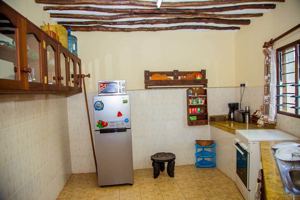 Villa | Private kitchen | Fridge, microwave, oven, stovetop