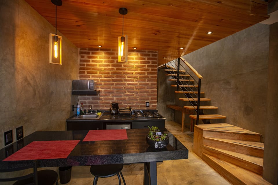 Superior Apartment | Private kitchen | Mini-fridge, microwave, stovetop, cookware/dishes/utensils