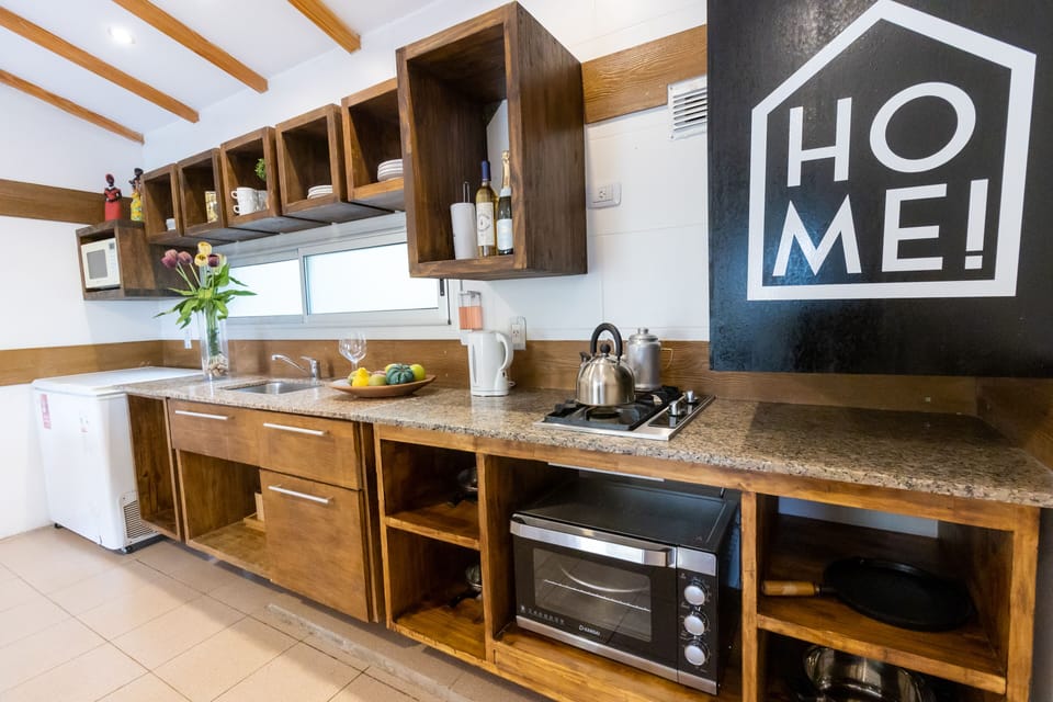 Elite Apartment | Private kitchen | Full-size fridge, microwave, oven, highchair