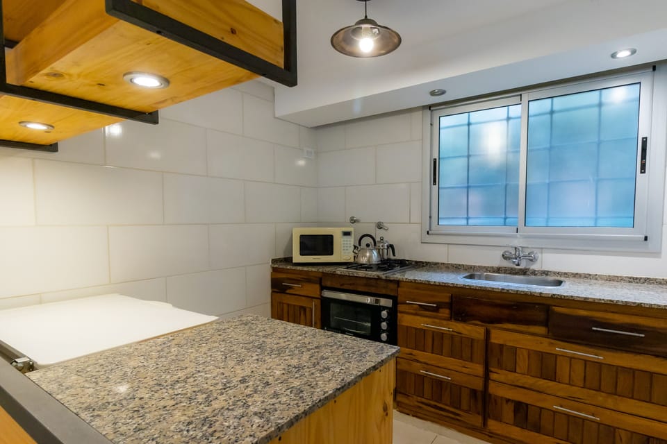 Superior Apartment | Private kitchen | Full-size fridge, microwave, oven, highchair