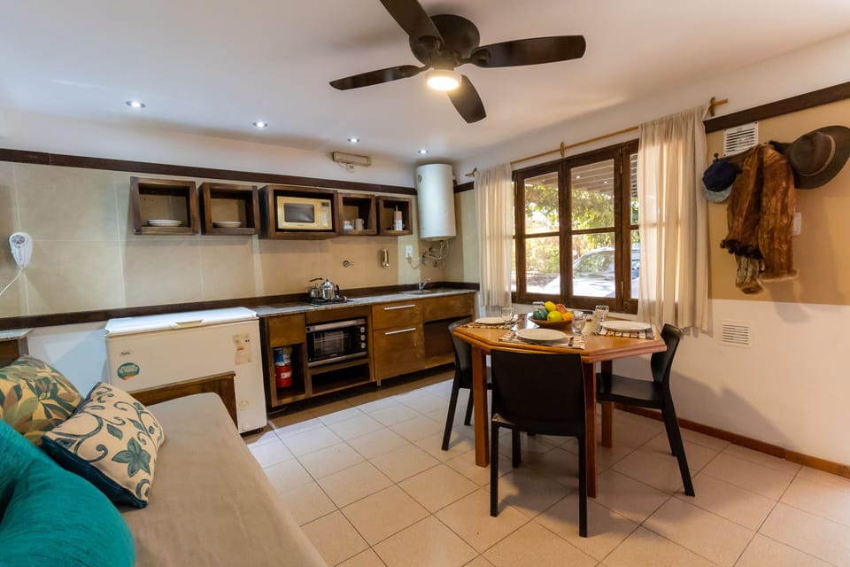 Standard Apartment | Private kitchen | Full-size fridge, microwave, oven, highchair