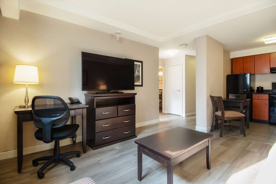 Suite, 1 King Bed with Sofa bed | Premium bedding, in-room safe, laptop workspace, blackout drapes