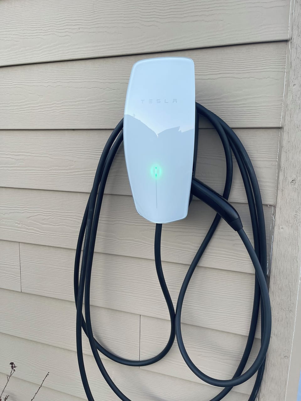 EV charger (Tesla Universal Wall Connector).