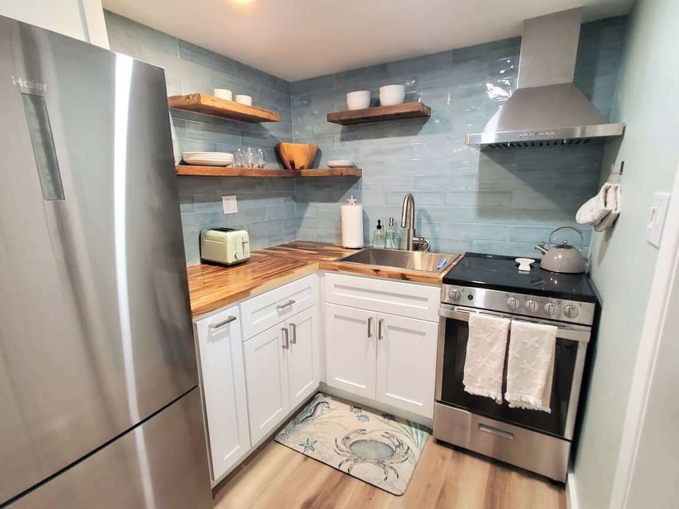Fully Stocked Kitchen! Pots, pans, baking sheets, blender, toaster, spices, oil and so much more! Don't forget to check out the coffee bar as well!