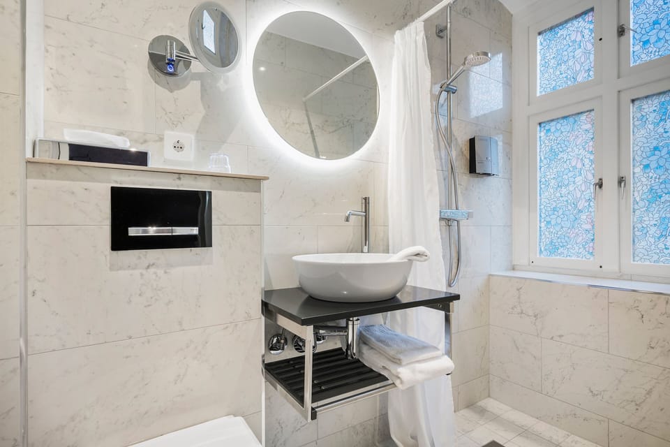 Shower, free toiletries, hair dryer, towels
