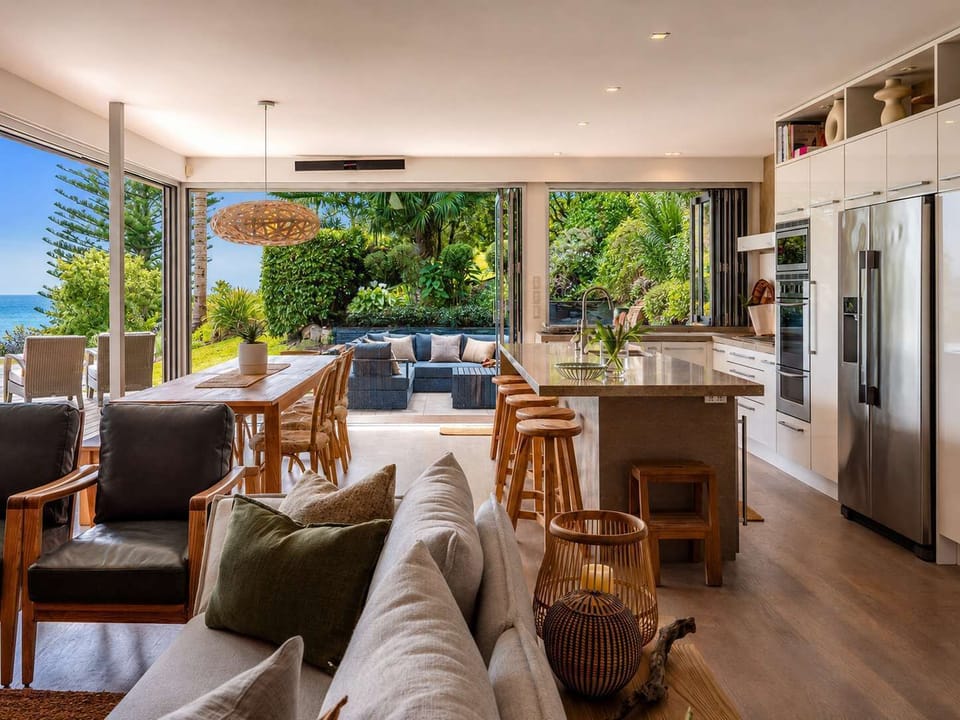 Open Plan Living and Dining Area with Access to Kitchen and Outdoor Living