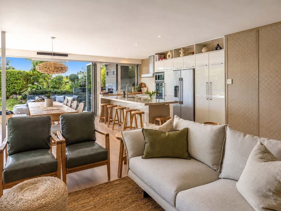 Open plan Living Area with Access to Kitchen and Outdoor Living