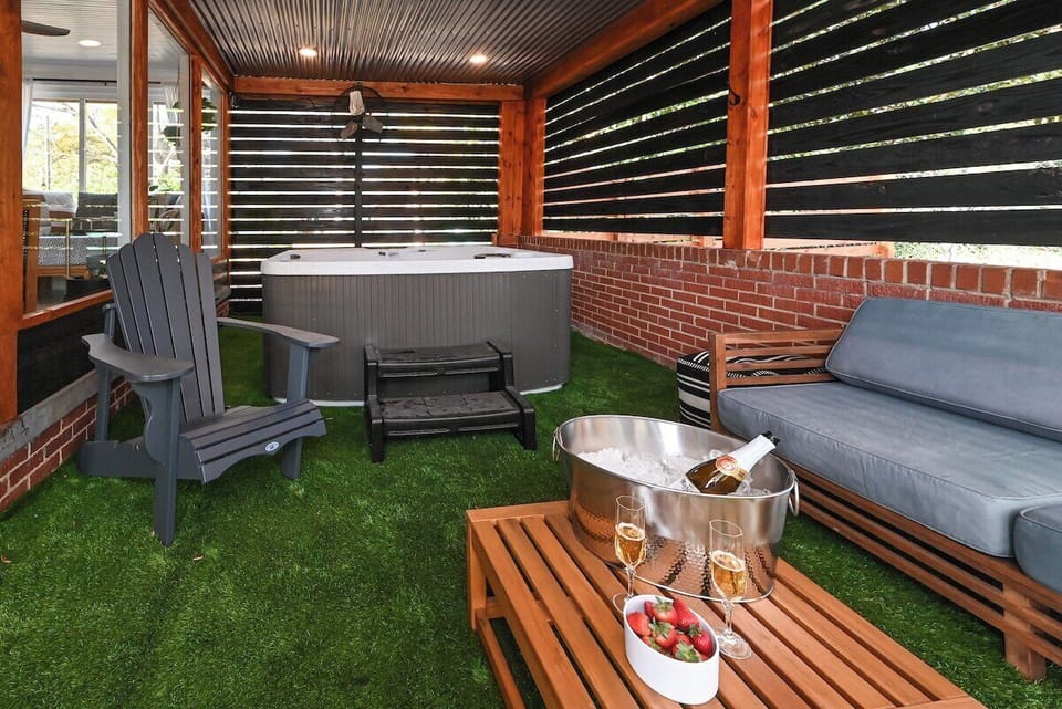 Hot tub (seats 6) with ample jets, lounge chaise, and color changing lights; oscillating fan for the covered porch area. Seating for 5 outside with coffee table. Planning a romantic getaway? Ask about our Romance Package