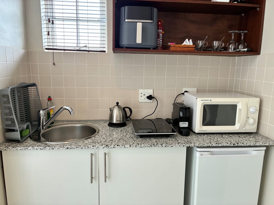 Luxury Penthouse | Private kitchen | Fridge, coffee/tea maker, electric kettle