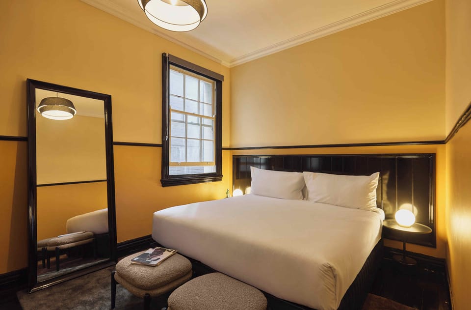 Premium bedding, pillowtop beds, laptop workspace, blackout drapes