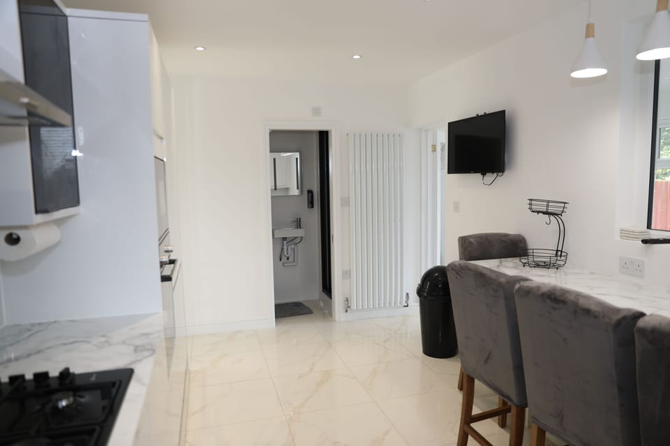 Kitchen with service toliet with shower