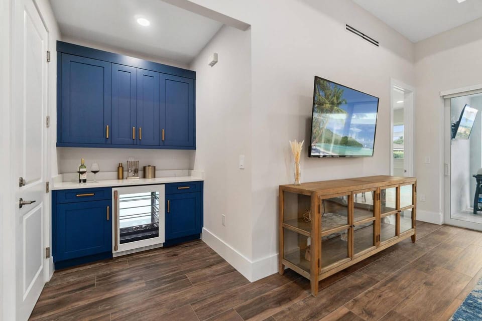 Behold the beauty of the large screen TV and the snack bar/beverage center.
