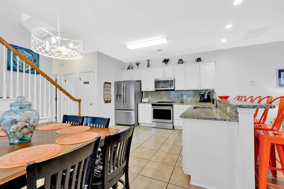 Dining Area with Breakfast Bar into Kitchen