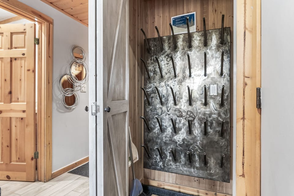 - Dedicated ski boot drying room with organized wall racks  
- Spacious storage keeps gear dry and ready for the slopes  
- Perfect mountain home feature for winter sport enthusiasts