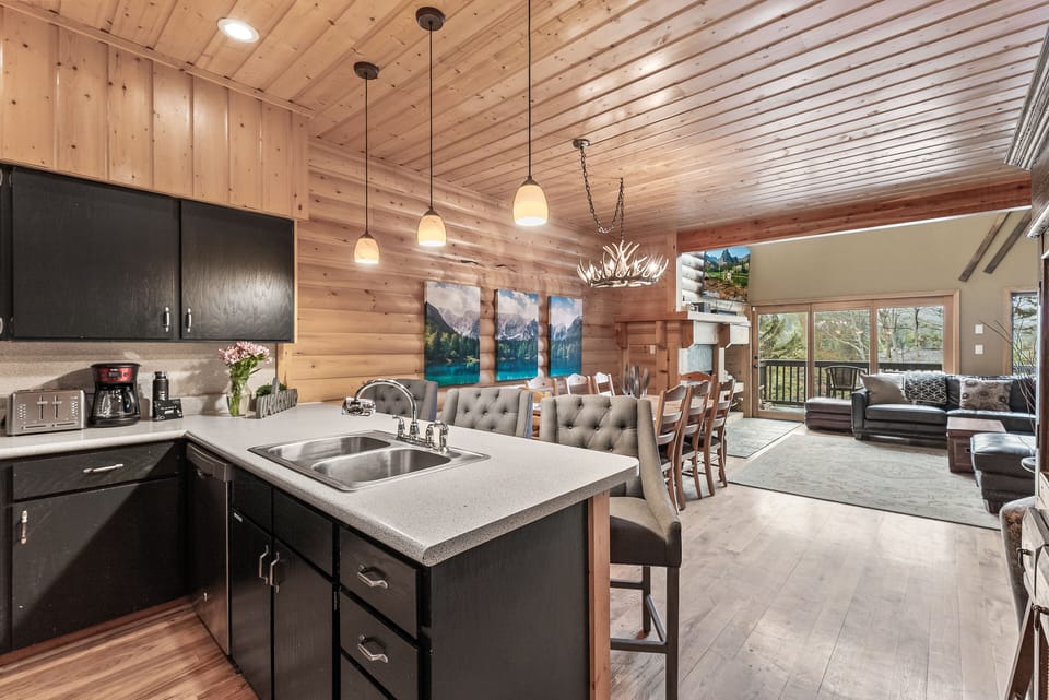 - Enjoy the open kitchen with island seating and pendant lighting  
- Full appliances and coffee maker ready for your stay  
- Easy flow into dining and living areas for gatherings