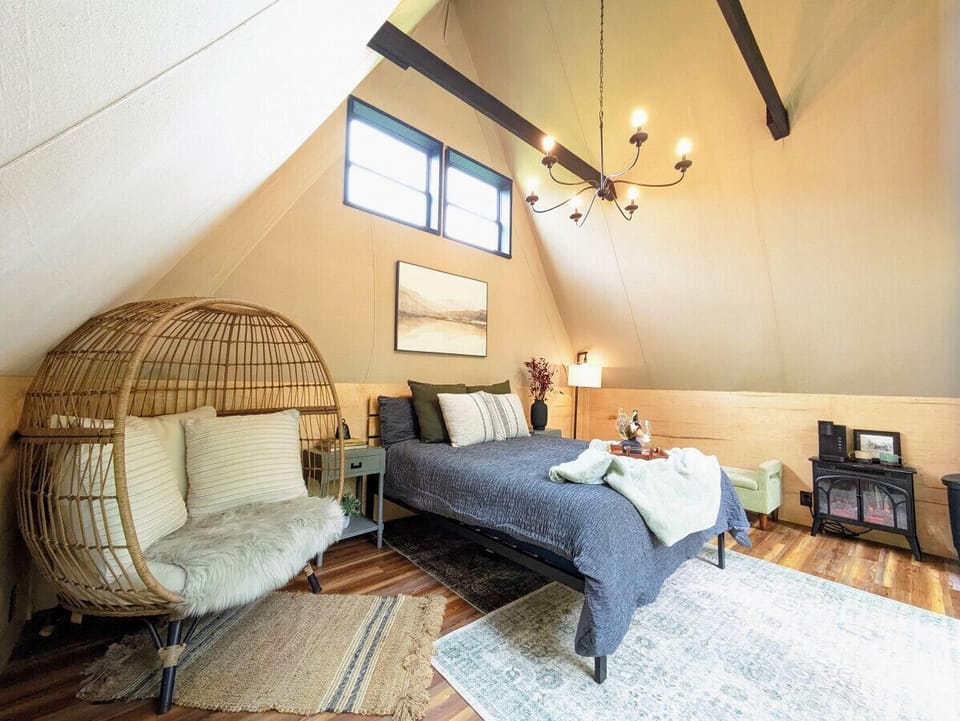 You have additional cozy seating, a keurig with cream and sugar, and an electric fireplace to cozy up!
