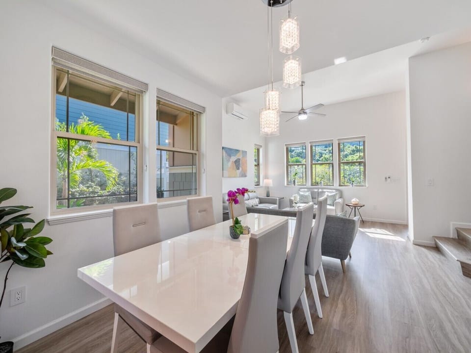 Dining area with premium dining table, 6 chairs and crystal chandeliers.