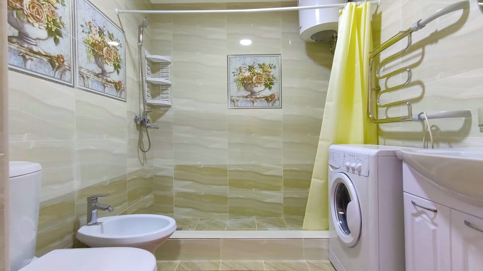 Luxury Studio Suite | Bathroom | Shower, hair dryer (on request), towels, soap