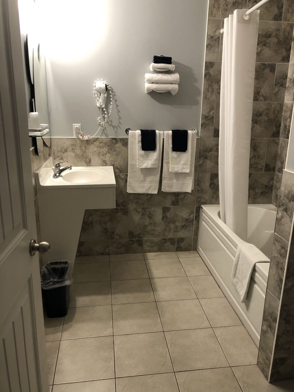 Family Suite, 2 Queen Beds | Bathroom | Combined shower/tub, hair dryer (on request), towels