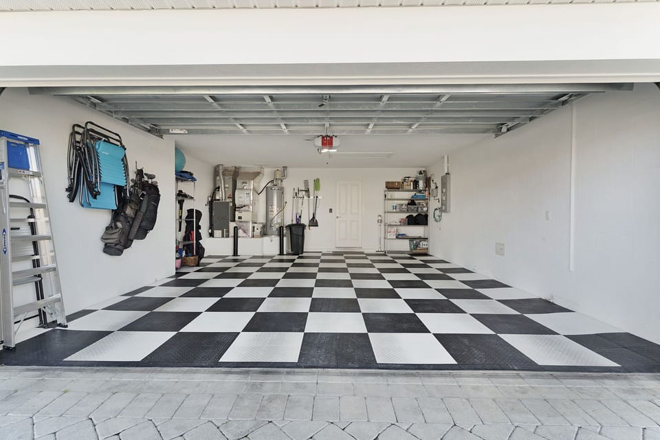 Your spacious garage features a striking checkered floor and organized storage for all your vacation gear and equipment.