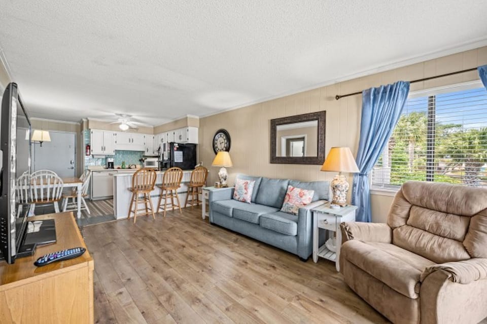 The ocean front living room is well-appointed with comfortable furnishings.