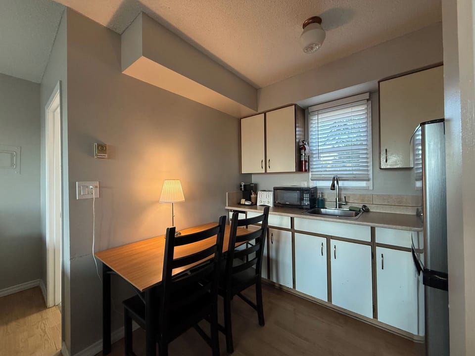 Standard Room, 2 Queen Beds | Private kitchen | Coffee/tea maker