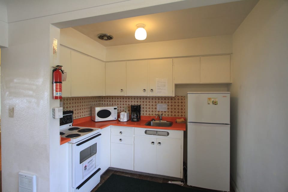 Deluxe Room, 1 Bedroom | Private kitchen | Full-size fridge, microwave, oven, coffee/tea maker
