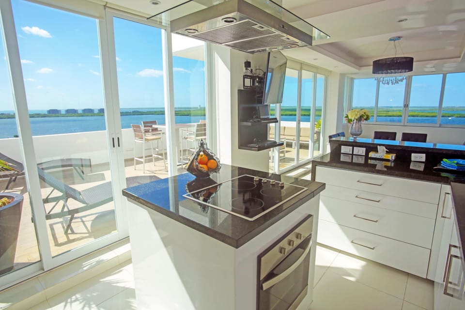 Access the Expansive Private Outdoor Space from the Kitchen as seen here or the Dining Area  - The Kitchen has a reverse osmosis system which provides plenty of clean drinking water