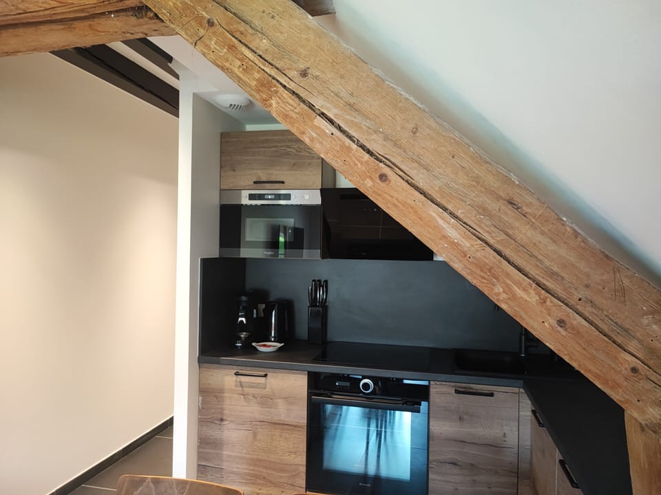 Deluxe Penthouse, 1 Queen Bed with Sofa bed | Pillowtop beds, individually decorated, laptop workspace