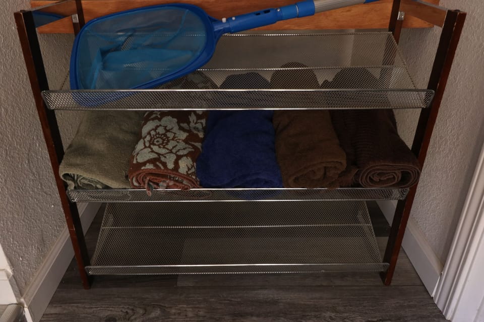 Towels and skimmer for pool. 