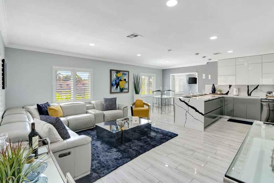Living Room | lends a warm welcome and flows into the luxurious kitchen