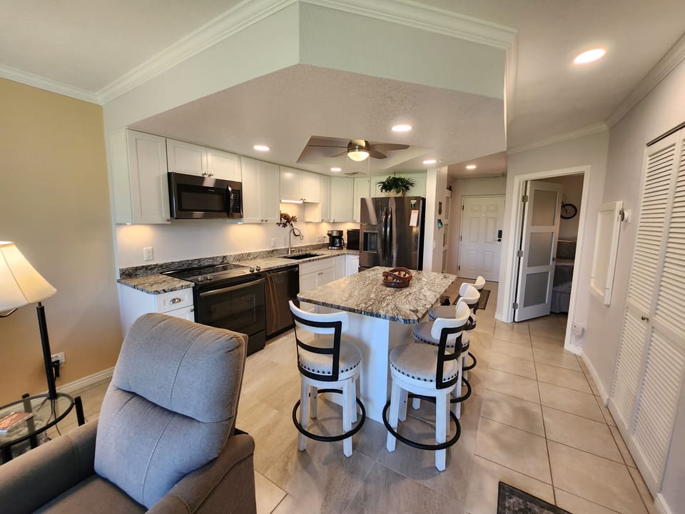 Kitchen and frosted glass door leading to front bedroom 